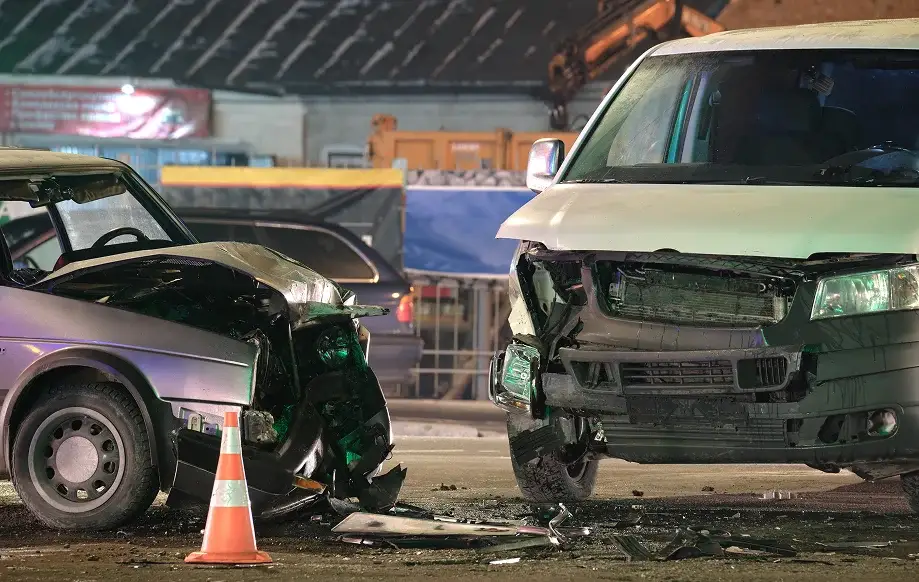 Auto accident collision between a compact car and a van