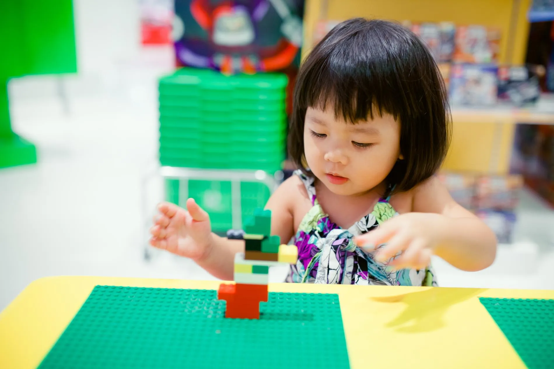 A child at a daycare center playing with a toy