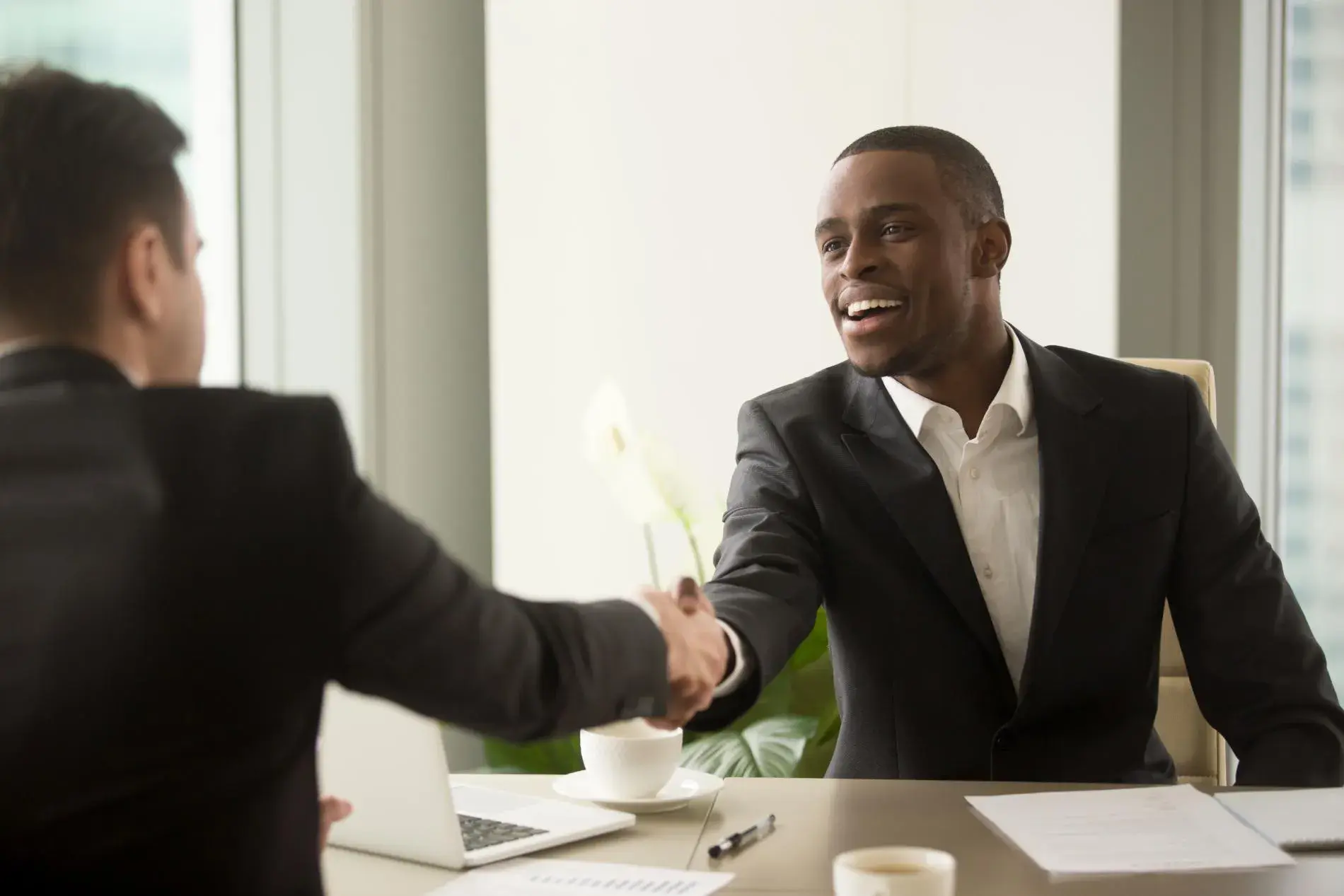 A man shaking hands with another man