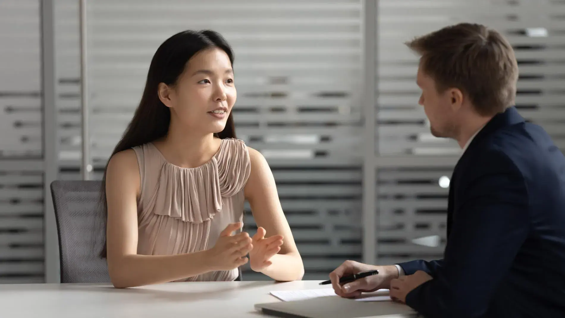 A woman speaking with a lawyer