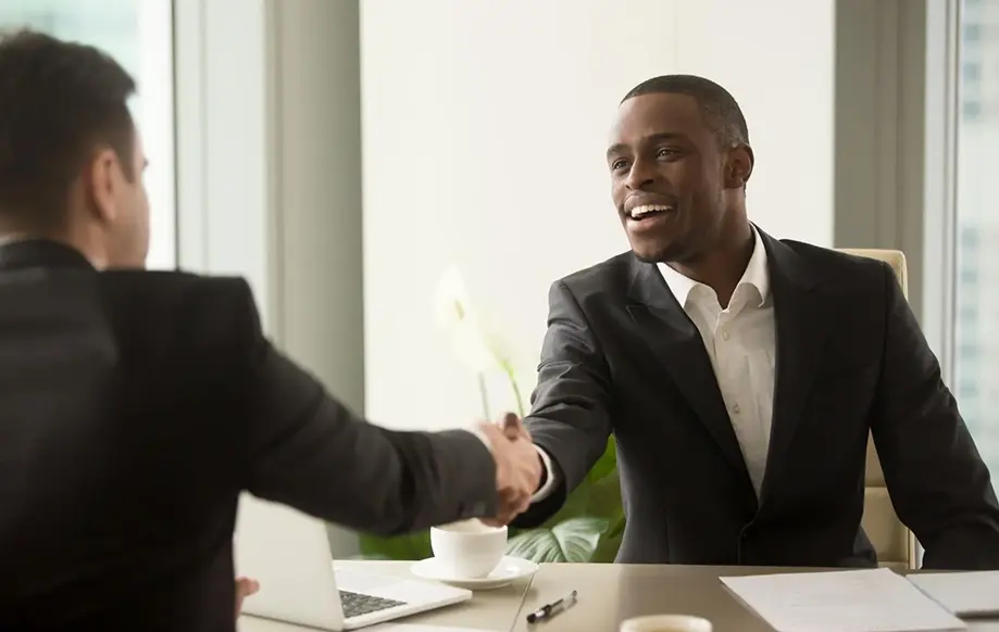 A lawyer and a man shaking hands