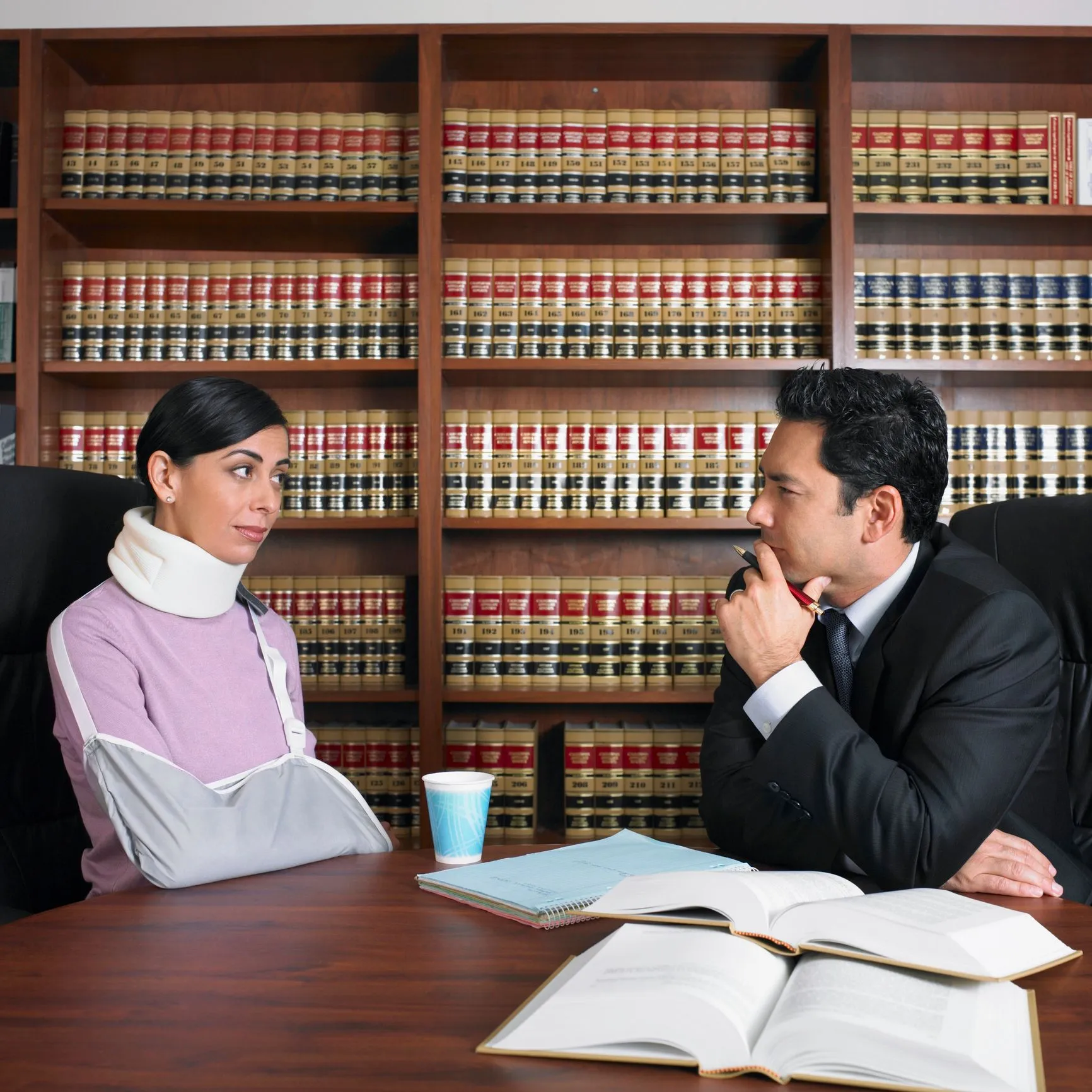 An Injured woman speaking with her lawyer